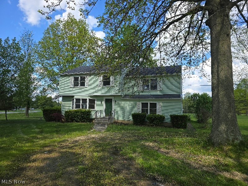 This 4-bedroom, 2.5-bath, 2300 square foot Colonial in Columbia Station is full of potential and ready for your personal touch. Ideally located near the Cuyahoga County and Lorain County border, this home offers spacious living areas and endless possibilities for customization.
The first floor features a welcoming entry and living room, formal dining room, oversized family room, sunroom with access to the deck, patio off the mudroom, and a convenient half bath. Upstairs, you’ll find three generously sized bedrooms, including a primary suite with its own private bath, plus an additional full bath for the remaining bedrooms. The fourth bedroom is charming and versatile — perfect for an office, nursery, hobby room, or guest space.Hardwood floors run throughout the home, complemented by ample closet space. While the property does need updates, the possibilities are truly endless on this beautiful 1.38-acre corner lot. The garage is a standout feature of its own, offering extra workspace and a partially finished mezzanine ideal for projects, storage, or future customization.Home is being sold as-is.