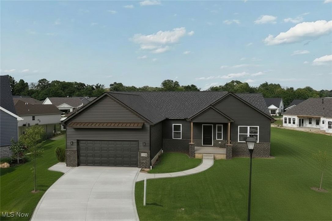 New Ranch Home Ready for immediate possession! 
This modern ranch in a quiet Seville cul-de-sac features a popular open floor plan and eye-catching dark exterior with brick accents. A wide driveway and covered front entry add to the home's curb appeal.
Inside, the eat-in kitchen offers a large quartz island, ample cabinetry, and a spacious pantry, perfect for organized storage and everyday convenience. The owner's suite includes dual sinks, a walk-in shower, and a generously sized walk-in closet.
Enjoy relaxing or entertaining on the lighted, maintenance-free covered back deck. The 2-car garage is equipped with water and electric, and the full basement provides great potential for future living space. Tankless Hot water heater so you never run out of hot water and you are not heating water when nott using it.
Conveniently located near I-71 and I-76, this home offers quick access to all of Northeast Ohio. Under construction now? Don't miss the chance to make it yours!