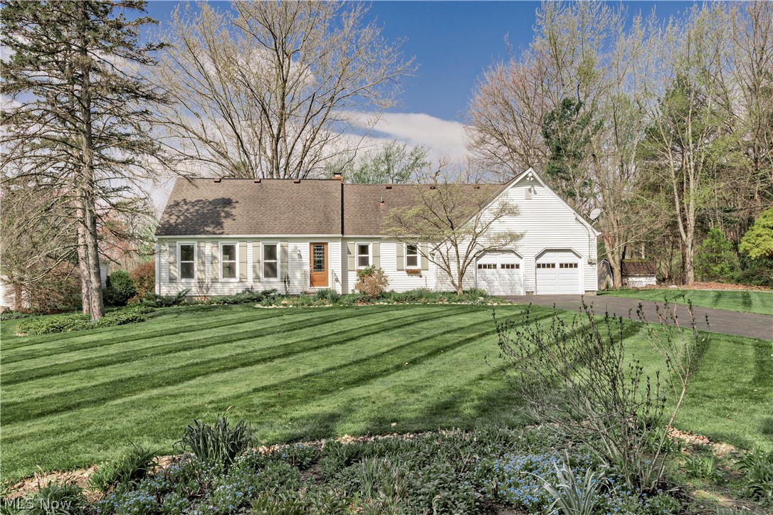 Opportunity awaits in this 4 bedroom, 2 full bath home situated on nearly an acre in a wonderful cul-de-sac neighborhood.  This home offers incredible potential for buyers looking to customize and make it their own.  The flexible floor plan has been thoughtfully adapted over time to suit the seller's needs.  A first floor bedroom is conveniently located next to a full bath,  offering options for guests, a home office, or first-floor living.  The main level also features hardwood floors throughout, an eat-in kitchen, a spacious living room, and a large dining room with a wood-burning fireplace and slider leading to the back deck.  Upstairs, you'll find 3 generously sized bedrooms, all with hardwood floors and a full bath.  There is an abundance of storage offered in the multiple hallway closets as well as additional walk-in storage off of the 3rd bedroom. Outside, enjoy the deck with hot tub overlooking a picturesque backyard.  Wander through the mature plantings and take in the sights and soothing sounds of the small pond with it's tranquil fountain.  This is a rare chance to create something truly special in a desirable setting. Located in the Award Winning Chagrin Falls School District and just a short drive from the Village and all that it has to offer.  Owners have completed many updates: (2026) New Electric Panel, Professionally Power Washed (2025) Complete Tear Off of Rear Roof, New Gutters, New Garage Doors and Openers,  Chimney Re-Flashed (2023) New Well Pump (2021) New Sump Pump (2019) New Sub Floors and Hardwood Floors Installed Throughout. Complete List of Updates in MLS.