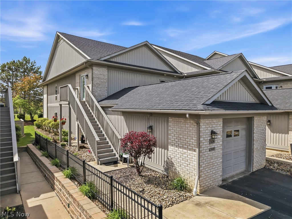 Enjoy this wonderful Lake front condo at Lake Milton Commons right off NE River Rd. This is a private gated community offering a clubhouse, exercise room, pool, and meeting room with a kitchen. THE UNIT COMES WITH IT’S OWN BOAT DOCK! PERFECT FOR THE UPCOMING SUMMER. It has two bedrooms, 2 full baths, large kitchen with newer stainless steel appliances, granite counters, island, and plenty of storage. Kitchen flooring is beautiful ceramic tile. Hard wood floors throughout the rest of the unit.  Master bedroom has sliding glass doors, which take you outside on the balcony with views of the lake and Harry Meshel Park.  Also. a large walk-in closet and beautiful remodeled bath. Bath has a soaking tub, enclosed tiled shower, and new cabinetry. The second bedroom has an updated full bath as well. The laundry room has a soaking sink and includes the washer and dryer with many cupboards for storage.  Many items will stay, see supplements. Remember the boat dock is included!  Owners would like it sold with the furniture listed in the supplements.