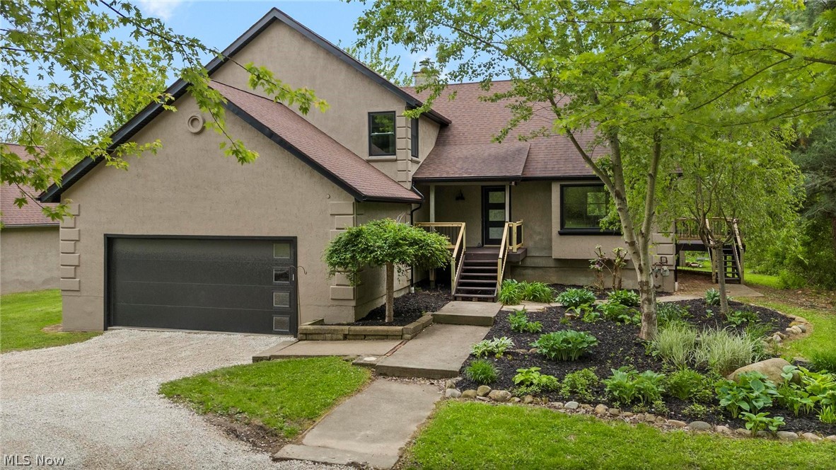 If you're looking to enjoy a little extra room to live, play, & grow in the highly sought-after Highland School District, this home is for you! Situated on just under 2 acres, this beautifully updated 4-bedroom, 3.5-bath home offers 2,666 square feet of finished living space with plenty of room both inside & out.

From the moment you step into the welcoming foyer, you're greeted by a light-filled formal living room with stunning bay windows overlooking the landscaped front yard. The adjacent dining room, with access to a side deck, creates the perfect setting for family dinners & entertaining. The heart of the home is the fully renovated kitchen, featuring brand new shaker-style cabinetry & SS appliances, a spacious island with seating, & a stylish modern backsplash. 

Just off the kitchen, the cozy family room with a wood-burning stove invites you to unwind, providing access to the large back deck overlooking a private backyard & small pond - perfect for kids, pets, & outdoor gatherings. The main floor also includes a beautifully updated laundry room & half bath for added convenience.

Upstairs, the expansive primary suite offers a true retreat with its own wood-burning fireplace, private deck with backyard views, & a generous sized walk-in closet. The ensuite bath has been completely updated with a large tiled walk-in shower, double vanity, & modern finishes. 3 additional bedrooms provide ample space for family or guests, including one with its own private ensuite bath, ideal for teens or in-law living.

For families needing extra storage, hobbies, or workspace, the property also features a 20x40 pole barn & 3 other smaller sheds, plus a freshly updated gravel driveway.

Nearly every inch of this home has been thoughtfully updated, including luxury vinyl flooring, new carpet & tile, all-new cabinetry, lighting, interior & exterior paint, windows, sliding doors, gutters & soffits, central air, hot water tank, garage door, front door & more.