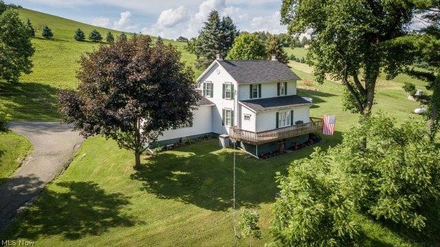 Spacious farmhouse with an eat-in kitchen, brick fireplace (not used), ample oak cabinetry with a 5-ft. island and a breakfast bar, kitchen appliances (new 2017). First floor master bedroom and first floor laundry. There are 3 rooms on the 2nd level with lots of storage space. Deck off kitchen leads out to the 12X30 above-ground oval pool (sand filtered pump and equipment 2 years old). Roof new in 2016. There is a 20X32 barn with electric (box stall for horses. Property has about 1.5 acres fenced), also there is room to park a vehicle. There are 2 water wells, one used for livestock only. Excluded from the sale: lawn ornaments, wooden wheel, 2 windmills and the deck umbrella. Carroll Co-Op is the electric supplier - monthly average $175. Propane gas monthly average is $175. This is a great home waiting for family that enjoys the outdoors.