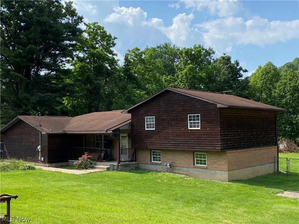 3 bedroom log sided split level home on 1+/- acre (0.976)!  Oak kitchen with island breakfast bar.  Rec room in the lower level features tongue and groove pine ceilings.  16 X 16 back deck.  24 X 36 attached garage.  Storage shed.  Current owner's utilities average $95 for electric, $72 for gas and $34.15 for water monthly.  Taxes reflect the seller receiving a homestead credit of $317.14 annually.  New roof being installed by the seller.