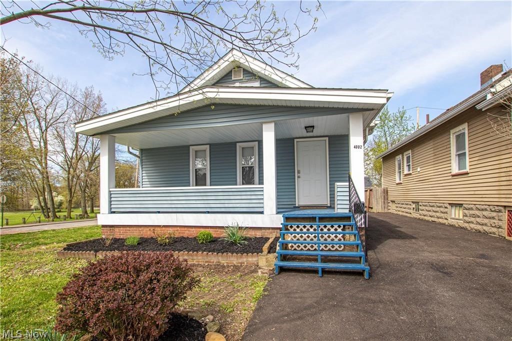 Enjoy a low maintenance yard and views of Calgary Park from both the 20-foot front porch and rear patio. Corner lot is also included! Open first floor features comfort- sized living room with fireplace, natural lighting from picture window, and leads to formal dining room with charming built-in leaded glass cabinets. Quality touches and finishes in kitchen (appliances included) and full bathroom with granite tile bathroom surround walls. Private and sprawling 2nd floor Master Bedroom with exposed brick chimney is the perfect space to wind down. Located in quiet Brooklyn Center, on cul-de-sac neighborhood with no thru traffic and the convenience to I176, I71. Updates on 2019 include: roof, windows, flooring, electric, bathroom, kitchen, driveway, furnace, AC, plumbing and light fixtures. One year home warranty included