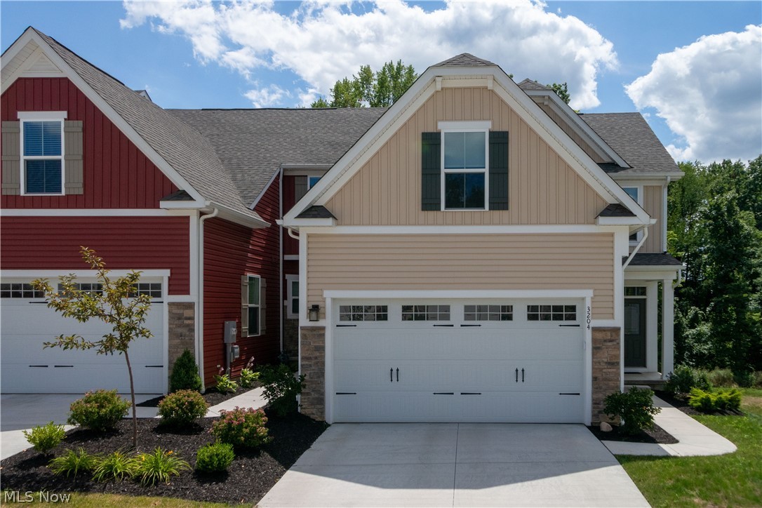 Newer construction without waiting for it to be completed!  Absolutely beautiful and only 2 years young!  Lots of upgrades in this end unit "Calvert" open floor plan.  Upgraded kitchen includes white cabinetry, granite counters with breakfast bar area, stainless steel appliances & pantry!  The combination dining area and great room are perfect for entertaining.  There are extra side windows in the dining area, which allow for more natural light that are a unique feature.  Enjoy access to the Trex deck off the great room to enjoy the wooded view and seasons.  The first floor master suite features walk in closet and full bath with walk in shower and double vanity.  The laundry and powder room complete the first floor.   The walk out lower level is super nice and features a large finished area with sliders to concrete patio and black fenced in backyard!  The second floor offers 2 spacious bedrooms and full bath.  Need space for storage?  There's plenty in the lower level.  Don't wait on t