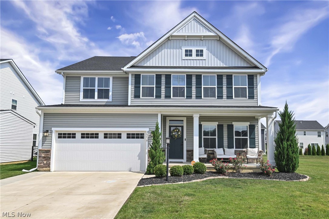 Prepare to be moved! Welcome to 36270 Jannie Lane, an exceptional Colonial built in 2022, offering over 4,100 square feet of beautifully designed living space in North Ridgeville's desirable Hampton Place community. From the charming covered front porch to the thoughtfully crafted interior, this home blends modern style with everyday comfort. Step into the impressive foyer, where a private home office provides the perfect space for remote work or study. The formal dining room is ideal for hosting holiday gatherings and special occasions before opening into the heart of the home. The stunning eat-in kitchen features an expansive center island with seating, abundant cabinetry, generous counter space, and a spacious dining area, all flowing seamlessly into the inviting living room with a cozy fireplace. A versatile bonus room on the main level offers endless possibilities as a playroom, sitting room, or second office, while a convenient half bath and mudroom complete the first floor. Upstairs, the  primary suite provides a private retreat with a spa-inspired ensuite bath and an impressive walk-in closet. Four additional generously sized bedrooms, two full bathrooms, and an upstairs laundry room create a functional layout designed to accommodate today's busy lifestyles. The partially finished basement expands your living space even further with a spacious family room, a sixth bedroom, a full bath, and an additional room ready to become a home gym, theater, hobby room, or whatever best suits your needs. Outside,  the backyard patio and yard offer plenty of space for outdoor dining, entertaining, or simply relaxing. An attached two-car garage adds everyday convenience. Residents enjoy access to the community pool just moments from home. Ideally located near shopping, dining, parks, and major commuter routes, this beautifully appointed home combines modern construction, flexible living spaces, and outstanding community amenities into one exceptional opportunity.