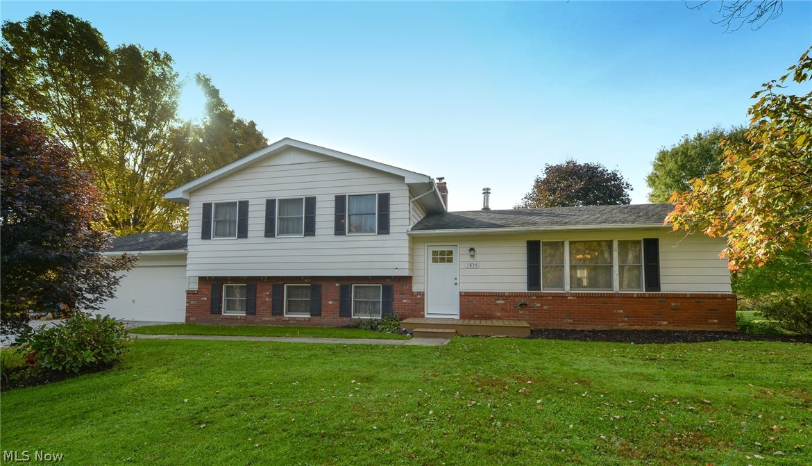 Rare open floor plan 2026 sq foot split level. The main floor has a 20 foot vaulted living room with a wood burning stove. Enjoy new stainless steel appliances in your updated kitchen. The lower level family room has a wood burning fireplace. Walk out of the family room to your back patio and enjoy your park like view. Enjoy 1.4 acres around the corner from Boston Mill / Brandywine ski resorts. There is also a brand new Recreation room in the lower level of the home. The bedrooms are all a good size. Located in Woodridge School District. Quick drive through the valley to Cleveland. Catch 303 to Akron, Medina, Fairlawn. Hit Akron Peninsula road for quick access to route 8, Hudson, Macedonia, Boston Heights, Stow, Silver Lake, Cuyahoga falls. Good location to get to anywhere in 30 minutes. Plus, far enough out of the way to enjoy country living. Around the corner you have small shops, golf courses, shopping, skiing, hiking, state parks and many more outdoor activities. This move in ready