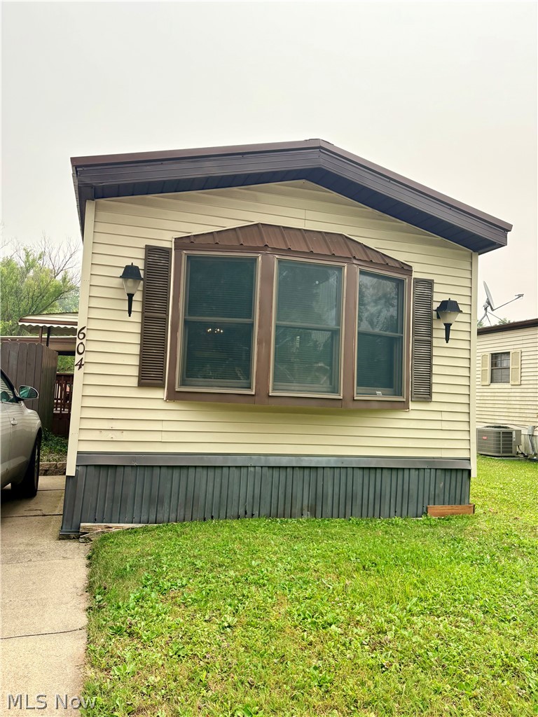 Located in Westwood Lake Park, this well-maintained 2-bedroom manufactured home offers comfortable living with recent updates throughout. Features include a spacious bathroom with double-sink vanity, garden tub, and newly installed standalone shower, plus a covered 19’ x 12’ side deck and uncovered 13’ x 9’ rear deck. Recent improvements include a new metal roof, updated flooring in the bathroom, hallway, and kitchen, new hot water tank, fresh paint, serviced furnace and central air, new ceiling fans, and new shed doors. Sold as-is; park approval required.