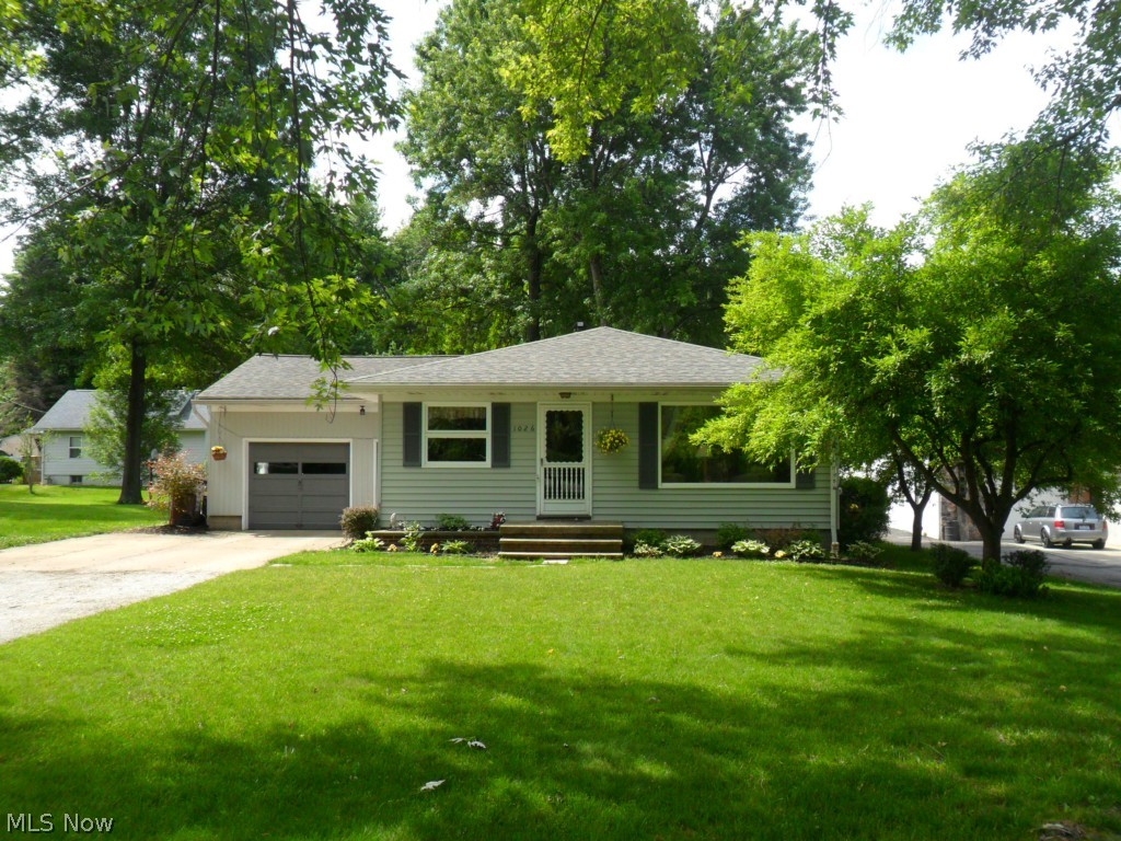 This lovely, well-maintained 3 bedroom, 1 bath ranch home provides both charm and functionality.  The interior decor is warm and inviting.  The kitchen makes great use of available space; it even includes a breakfast nook (includes newer appliances).  The dining room has nicely finished hardwood flooring and finished pine wood walls.  The spacious living room is inviting and comfortable with large windows and a decorative mantle space.  The carpeted master bedroom has a charming decor and adequate closet space.  The additional bedrooms have hardwood floors; one has finished pine wood walls.  The bathroom has a clean, bright decor and full-size tub/shower with functional vanity space.  The partially finished basement (completed 3 yrs ago) provides added living space that is great for entertaining.  Outside you'll find a spacious, treed lot with 1 car, attached garage, outdoor paito, and additional screen-room patio space (re-screened 5 yrs ago) perfect for enjoying relaxing summer eveni