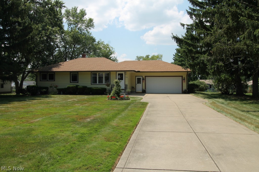 Gorgeous Original owner, three bedroom Ranch home with two full baths situated on a beautifully landscaped lot.  Meticulously maintained, just waiting for its new owner to occupy and put their own touches in this house.  Walking up the large driveway to the house, there is a small front porch/stoop area as you enter the front door the generously sized family room greets you.  Carpet has been replaced, 2015.  The kitchen has a lovely eat in area with ample cabinet storage and counter space.  There are three spacious bedrooms and two full meticulous bathrooms.  Roof and furnace have been replaced in 2006; Stove, Chimney and A/C replaced in 2012; Hot Water Tank replaced in 2011; Garage Door replaced in 2008; Garage is heated with hot and cold water.  Newer Windows in 1997 with some warranty left.  Drains have just been cleaned out, 2015.  There is a very spacious, large backyard and a back porch where you can sit out and enjoy the beautiful scenery.  The expansive finished basement has a