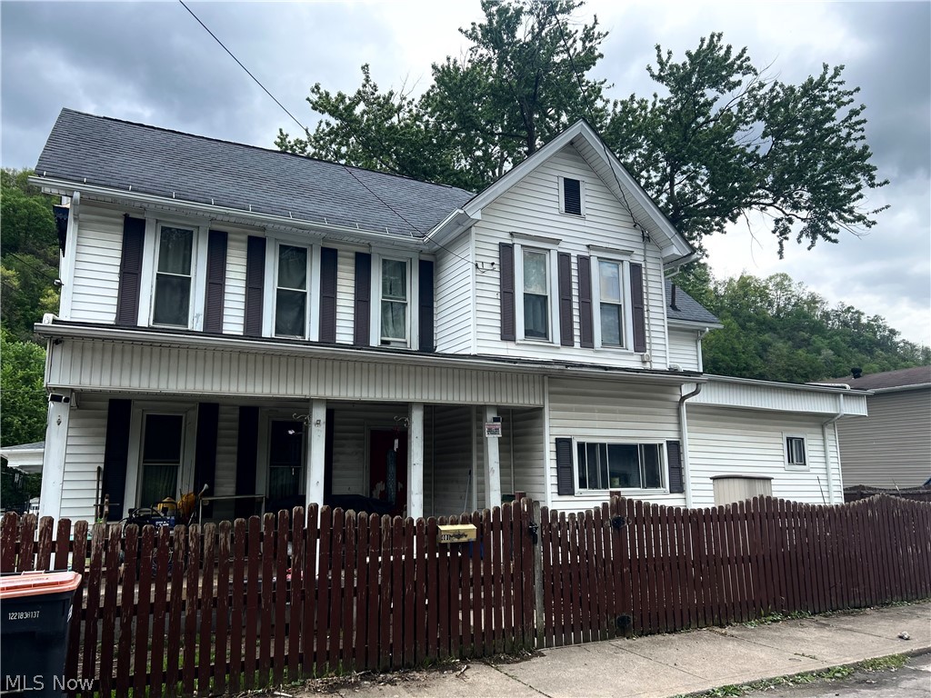 Turn potential into profit! Classic character located just blocks from the Ohio River. This spacious home offers incredible curb appeal with a gabled roofline and a deep, covered front porch- perfect for evening relaxation and river breezes. The fenced-in yard and unique architectural details provide a fantastic canvas for your creative vision.