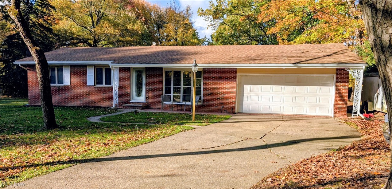 Beautiful brick ranch on a private cul-de-sac with only five houses.  One neighbor on west side of house and a vacant lot with loads of trees on the east side of the house.  It has a newer roof (2021), furnace-A/C (October 2024), gutter guards (July 2025), brand new garbage disposal, and a heated two-car garage.  There are three full baths--master bath is handicap-accessible, hardwood floors through--even the kitchen has shiny hardwood floors and the cabinets are custom-designed.  The full basement has loads of cabinets, great for hobbies/crafts/toys or storage.  There are two outbuildings --one with electric.  All that and a generous .73 acre lot with a pond.  Great for first-time buyers or retirees.