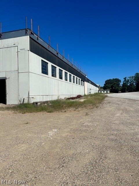 FOR LEASE ONLY.  Open space of 20,800 sq ft, with 21'-22' ft ceilings, ideal for storage or light manufacturing.  Minutes from downtown Marietta, easy access to State Route 7 and minutes to I-77.  Building's amenities:  Electric 3 phase, crane rails in place, gas radiate heat, currently 3 doors, drive through ability.