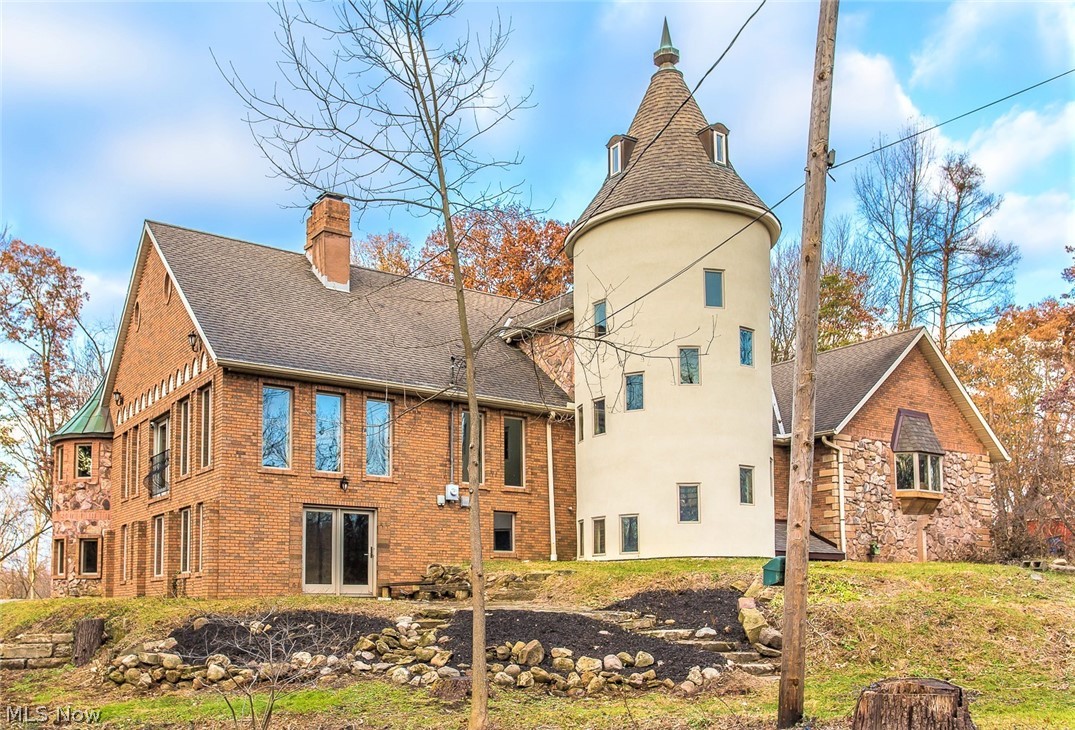 *Architectural Masterpiece! Spectacularly Luxurious AND Turn Key Remodeled All Brick CASTLE W/Turrets, Described Only As A DREAM HOME! *4,700 Square Ft. Main Home Boasting 4 Bdrms, 3.5 Bthrms, A 3 Car Heated Garage, 1000 Sq. Ft Finished 2nd Flr Entertaining Rm, Finished Walkout Lower Level, 2 Master Suites & Guest Home W/600 Sq. Ft ~ Sitting On 2.74 ACRES W/The Tuscarawas River Running Through The Back Yard! *Guest Home Features 1 Bd, Ba, Living Rm, New Kitchen. Laundry & Full Basement. Remodeled For An In-Law, Rental Or Preferred Use! *FISHING In Your Own Yard! *Home Sits Far Back From Rd. On A No Outlet Street W/Bridge Entry *TWO STORY 22' High, 13' Extra Wide Stone Floor To Ceiling Fireplace Captures The Focal Point W/Walls Of Windows In The Living Rm - Not Seen In ANY Other Home! *2 Stories Of Steel Welded Commercial Grade WINDING Spiral Staircases W/Wood Finishing & Custom Rod Iron Railings! *3 FIREPLACES! *ALL Bdrms 1st Floor Making This A Home For ANYONE! *1st Flr Laundry! *Fini