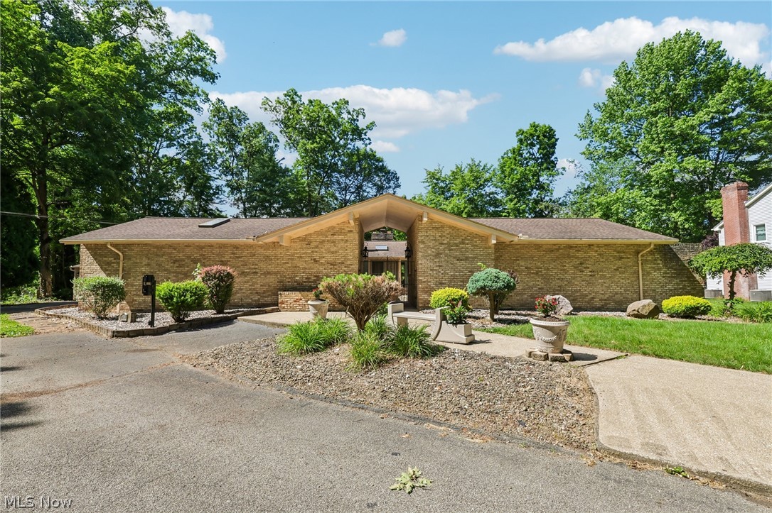 Welcome to this one-of-a-kind California Contemporary ranch nestled on a picturesque 0.70-acre park-like lot in one of Girard's most desirable neighborhoods. Offering over 3,400 square feet of living space, this spacious home features 3 bedrooms, 3.5 baths, and an architectural design that blends character, comfort, and functionality. The home's single-level layout provides generous living and entertaining spaces filled with natural light, while the unique contemporary design creates a warm and inviting atmosphere. The private setting, mature landscaping, and expansive yard offer the perfect backdrop for relaxing or hosting family and friends. Conveniently located near shopping, dining, schools, and major highways, this property presents a rare opportunity to own a distinctive home with incredible potential in Liberty Township/Girard.