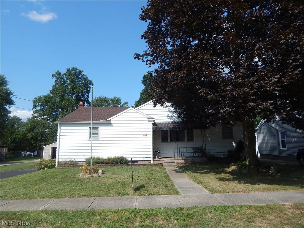 Opportunity at it's BEST! Beautiful hardwood floors featured throughout first floor.  Oversize living room, eat in kitchen, 
Updated roof and bathroom. Walk out lower level. Garages underneath. 
Needs a little TLC.  Near schools, park and shopping. Everything you want or need within minutes. 
Park like rear yard. Deep play yard.