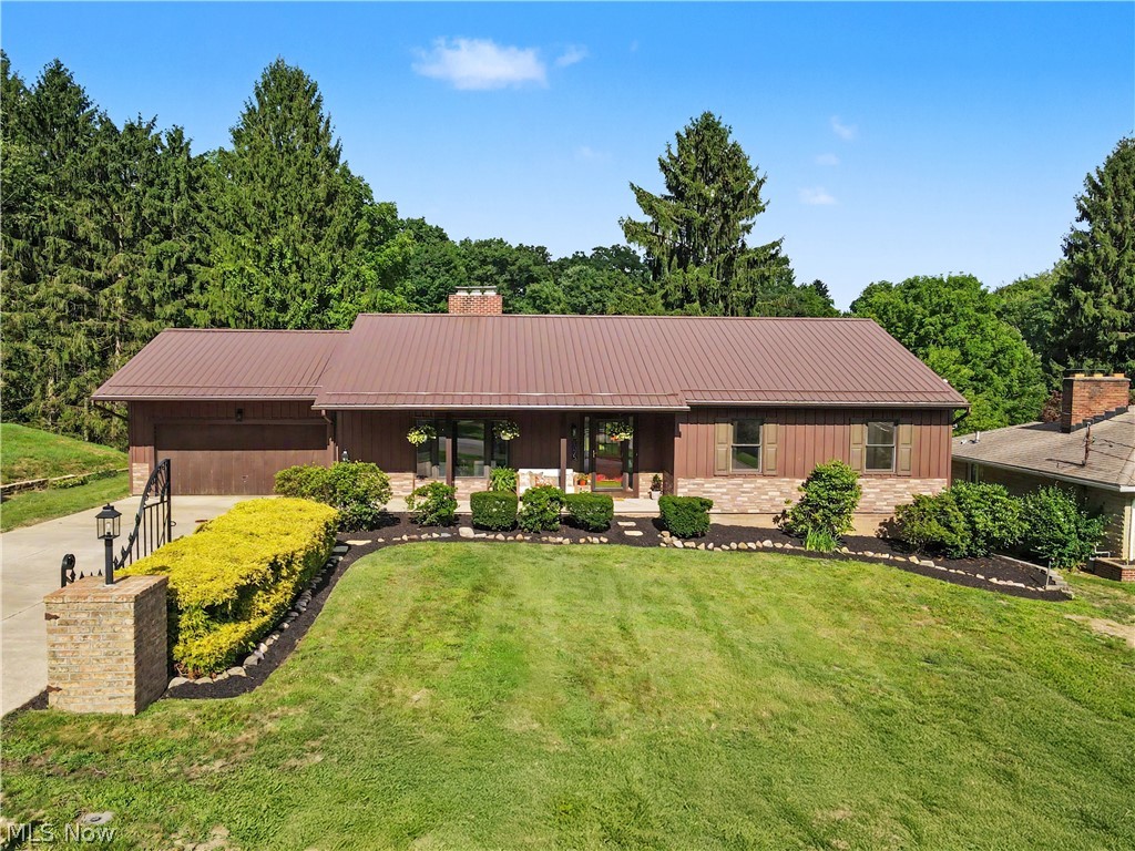 Enveloped by nature, this one of a kind ranch with a walkout lower level offers the perfect blend of modern updates and an exceptional setting. Completely renovated throughout, this move in ready home feels like new and is ideally situated next to Cuyahoga Valley National Park. Enjoy peaceful backyard views overlooking the park's meadow and iconic red barn, creating a truly special backdrop.
Step inside to a bright and inviting living room featuring a wood burning fireplace and new light wood flooring that extends throughout the main level. Walls have been removed to create an open, airy layout that flows seamlessly into the spacious kitchen, complete with a new large breakfast bar, high end appliances, abundant workspace, and walks out to large new trex deck. The first floor also offers a convenient laundry room with new Speed Queen washer and dryer, three bedrooms, and two beautifully renovated bathrooms, including a spacious primary suite with a large walk in closet.
The finished walkout lower level adds exceptional living space with new luxury vinyl flooring, oversized windows that fill the space with natural light, a full bathroom, office, bonus room, ample storage, and a new HVAC system.
Outside, the backyard is truly a retreat with a new deck, updated railings, patios, fire pit, and storage shed, all designed to take full advantage of the incredible natural surroundings. A gated drive, and covered front porch adds even more charm and curb appeal. Every detail has been thoughtfully updated, making this a rare opportunity to enjoy modern living in an unforgettable location. Quick possession.