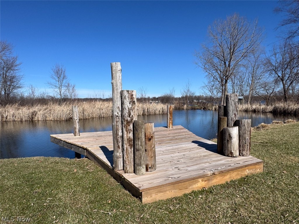 Absolute Auction. (2) Vacant Lakefront Lots. Springfield Lake, Private Dock, Zoned R4. Summit County, Lakemore Village, Springfield LSD. Live Onsite with Online Bidding. Owners no longer have a need. ABSOLUTE AUCTION, all sells to the highest bidder. ONLINE BIDDING BEGINS WEDNESDAY, APRIL 15, 2026, AT 9:00 AM, AND AUCTION LIVE ON-SITE BIDDING WILL BEGIN THURSDAY, APRIL 16, 2026, AT 12:00 PM. Entirety - .4595 acres total. 120’ x 145’ total. All utilities are available at the street. Build one or a multitude of homes with lake frontage, nice private dock with Springfield Lake (289 acres) access. Real estate half-year taxes are $939.51. Great opportunity to develop or turn into a weekend getaway. 4 parcels #5402806, 5402807, 5402805, 5402804. Call Lakemore Village zoning for your particular needs. Walk the property with permission only, call the auctioneer. 
Auction #1 - .2597 acres total with 60’ frontage and shared dock. Parcels 5402806, 5402807.
Auction #2 - .1998 acres total with 60’ frontage and shared dock. Parcels 5402805, 5402804.
Auctioneers' Note: Auctions 1 and 2 will be offered separately and together, sold whichever way it brings the most.