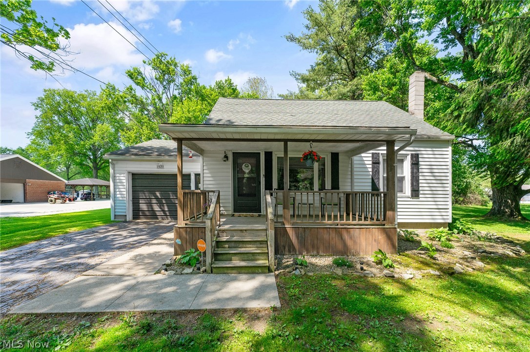 Welcome home to this cozy and completely updated cape cod nestled on 2 beautiful acres in the Weathersfield School District.  This charming 3 bedroom home offers a cozy and comfortable living space.  Enjoy the convivence of an attached single car garage, plus an additional 20x20 bonus garage in the back-perfect for storage, a workshop, hobbies or recreational vehicles.  Inside you'll find tasteful updates throughout while maintaining the warm, character of this home.  The unfinished basement provides endless possibilities for storage or future living space.  If your looking for peaceful country-style living with modern updates and extra garage space, this property is a must see.