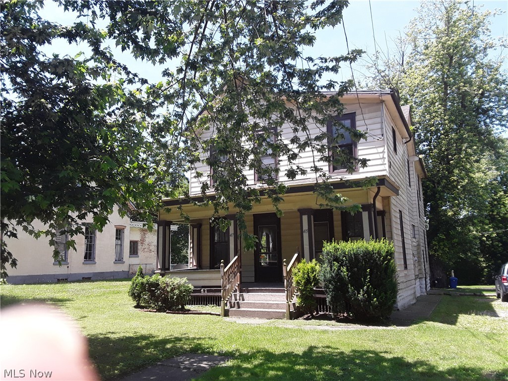 Great Opportunity for investors fenced area in back. Kitchen has wood floors, oak cabinets, island w/ sink, garbage disp. cupboards above for more shelving for easy access items. stove ref, dishwasher to stay. Dining room has hardwood floors with lead glass windows, French doors from DR area to LR with another ornamental FP. Upstairs has a room currently being used as a sewing room but could be used as a 3rd BR.Full bath has washer & dryer hook up w/ on demand water heater which will stay w/ property. Large BR also has orn. FP, several ceiling fans up & down stairs.2nd floor has eat in kits, garbage disp, plenty of cupboard space, stove and ref. dining room living room Property has 3 separate parcels 415-417 is duplex and river frontage 413 is vacant lot Water bill is combined for both units, gas & elec. have separate meters. Can be residential or multi family , live in one side and rent the other to help with your mortgage. Lot #5 is 30 x 125, lot #4 is 30 x 125, parcel # 81-50-98-07-