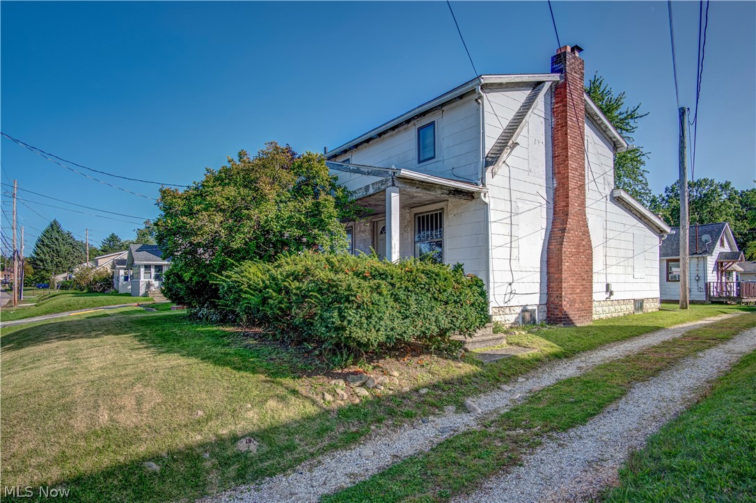 2 homes for the price of 1!!  This property could be used for rental purposes or live in one and make the other an in-law suite, tons of possibilities!  Don't let the exterior fool you, the inside of the main house has been completely renovated!  With some siding and work to the front porch, the main house would be gorgeous!  Completely renovated, fully applianced kitchen with plenty of white cabinetry (replaced 2008) and natural light from the ceiling skylight.  Open concept from kitchen, dining area, and living room with wood-burning fireplace.  The main level also includes a first-floor bedroom along with a full bathroom.  Upstairs you will find 2 more nicely sized bedrooms and another full bathroom with a shower and granite-topped makeup vanity. The back house is a 1 bedroom / 1 bathroom ranch on a slab and  is currently being rented out.  Other updates include; electrical, plumbing, drywall, shower upstairs, appliances and garbage disposal in the kitchen, refinished all wood floor
