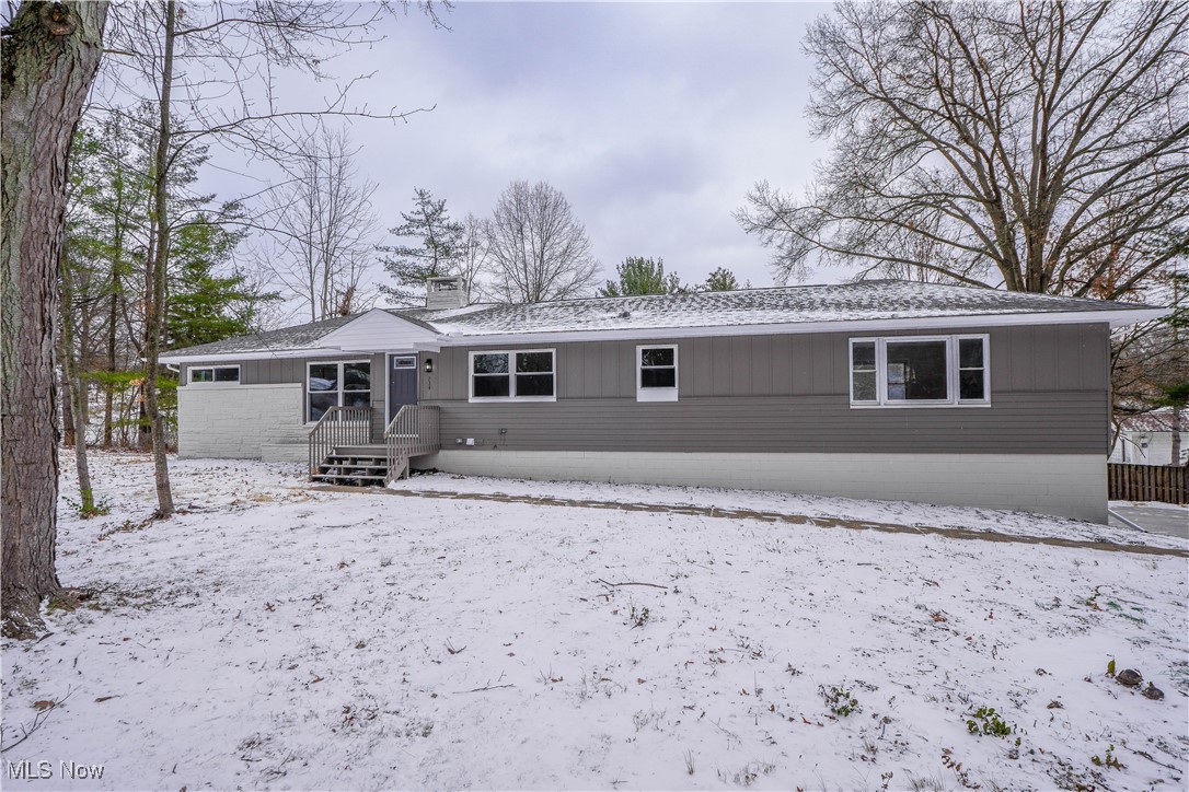 Experience the ease of ranch living in this beautifully remodeled 4 bedroom, 3 bath home on a private wooded lot! Thoughtfully updated with a new furnace, A/C, windows, electrical and plumbing systems, plus exterior and garage doors, a new concrete driveway, sidewalk, and patio—everything is ready for you to move right in.

Step inside to an inviting open floor plan where the living room with a cozy fireplace flows into a stunning eat-in kitchen. You’ll love the quartz countertops, stainless steel appliances, and tile backsplash. Just off the kitchen, a spacious family room with three bay windows offers wonderful views of the yard. The 1st floor laundry is conveniently located nearby, along with a private primary suite featuring a walk-in closet, double vanity, and a tiled shower. A split-bedroom layout gives the remaining bedrooms their own space on the opposite side of the home, along with a beautifully updated full bath with a double vanity and tiled tub/shower.

The lower level is a fantastic bonus, offering a rec room with a fireplace, a brand new full bath, and a flexible bonus room with a private entry—perfect for a home office or hobby space. A mudroom inside the attached two car garage makes it easy to keep coats and shoes organized.

Set on over half an acre, this corner lot offers plenty of privacy while keeping you close to Cuyahoga Valley National Park, Metro Parks, highways, and everyday amenities. Don’t miss your chance to see this wonderful home—schedule your showing today!