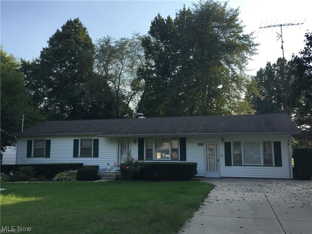 Newton Township. 3 bedroom 2 bath ranch on 3 lots. Large kitchen with pantry and lot of cabinets. Family room with gas heater, walk out to enclosed porch/sun room, full bath in basement, newer roof. Basement waterproofed by Ohio Basement Systems. Shed, detached garage, shady back yard.