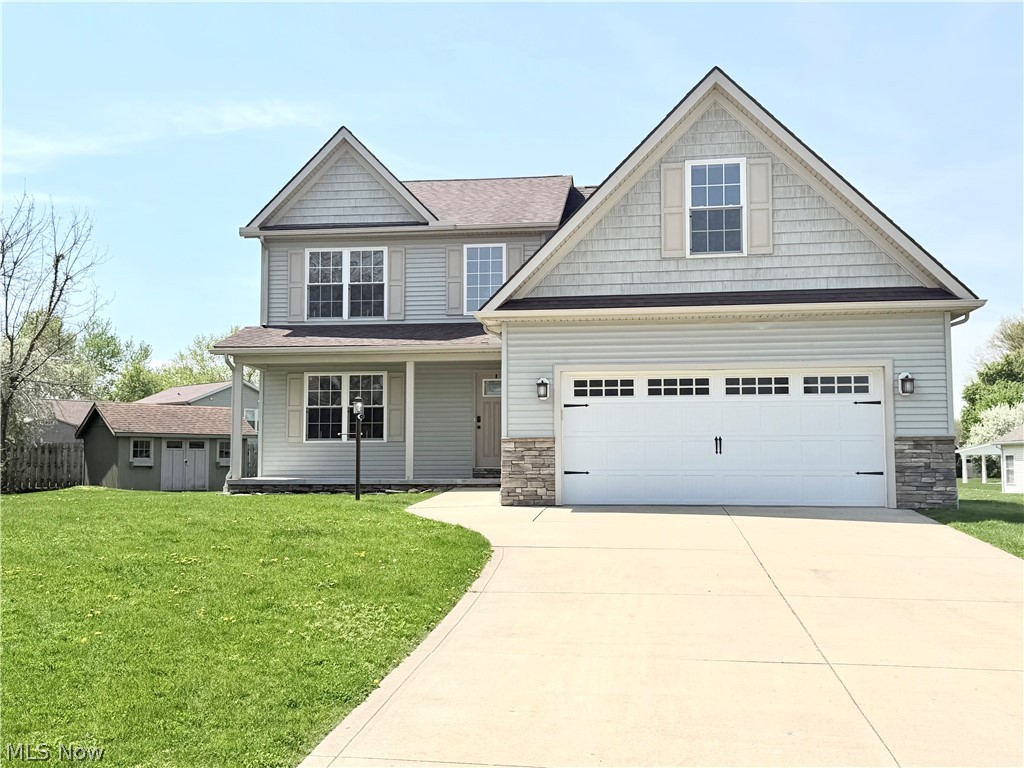 Beautifully maintained 4-bedroom, 2.5-bath Colonial located on a quiet cul-de-sac in desirable Perry Township — with NO HOA! This move-in ready home features hardwood floors, an open and inviting layout, and a stunning floor-to-ceiling gas fireplace. The spacious kitchen offers soft-close cabinetry, ample counter space, and included appliances, flowing seamlessly into the dining and living areas.
Upstairs, the oversized owner’s suite includes a private bath, dual vanities, and an impressive 12’ x 17’ walk-in closet with custom built-ins. The unfinished basement with full bath rough-in offers endless potential for additional living space.
Additional highlights include first-floor laundry, a 2-car attached garage, covered front porch, matching storage shed, and pride of ownership throughout. A rare opportunity to own a spacious, well-cared-for home in a great location with no HOA fees or restrictions!