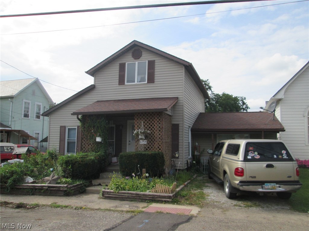 This home has everything you are looking for - Large inviting living room, eat-in kitchen with plenty of counter/cupboard space and a bonus 15 x 20 family room.  First floor bedroom, bath and laundry.  2 HUGE bedrooms upstairs.  Nice flat, private backyard with brick patio (excludes storage sheds).  BONUS - 32 x 36 insulated, heated, over-sized workshop with electric...PLUS a separate finished living space...it even has a kitchen!  This building is everyone's dream!  Perfect for anything/everything - family reunions, graduation parties, holidays, man cave, craft room....or a potential rental?  The home is great and this space is FANTASTIC - come check it out!  Roof, furnace updated approximately 6 years ago.