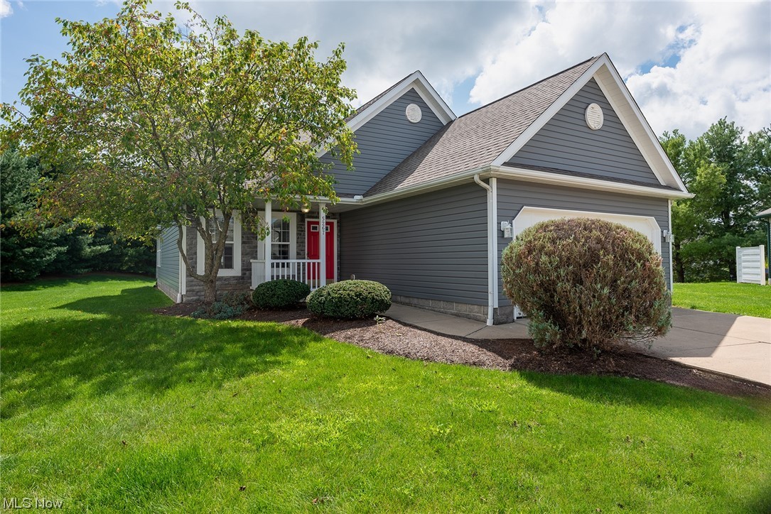 Free standing condo at the end of a cul-de-sac in the Village of Marsh Landing! With soaring ceilings and an open floor plan, this home offers a large great room, kitchen with an island, dining area and a bright sunroom with sliders out to the private back patio. First floor primary suite with walk in closet and full bath boasting dual sinks, plus separate tub and shower.  First floor laundry and half bath as well! Bright and sunny second floor with spacious loft, full bath and 2 spacious bedrooms. 2 car attached garage. Brimfield Township and Field Schools!