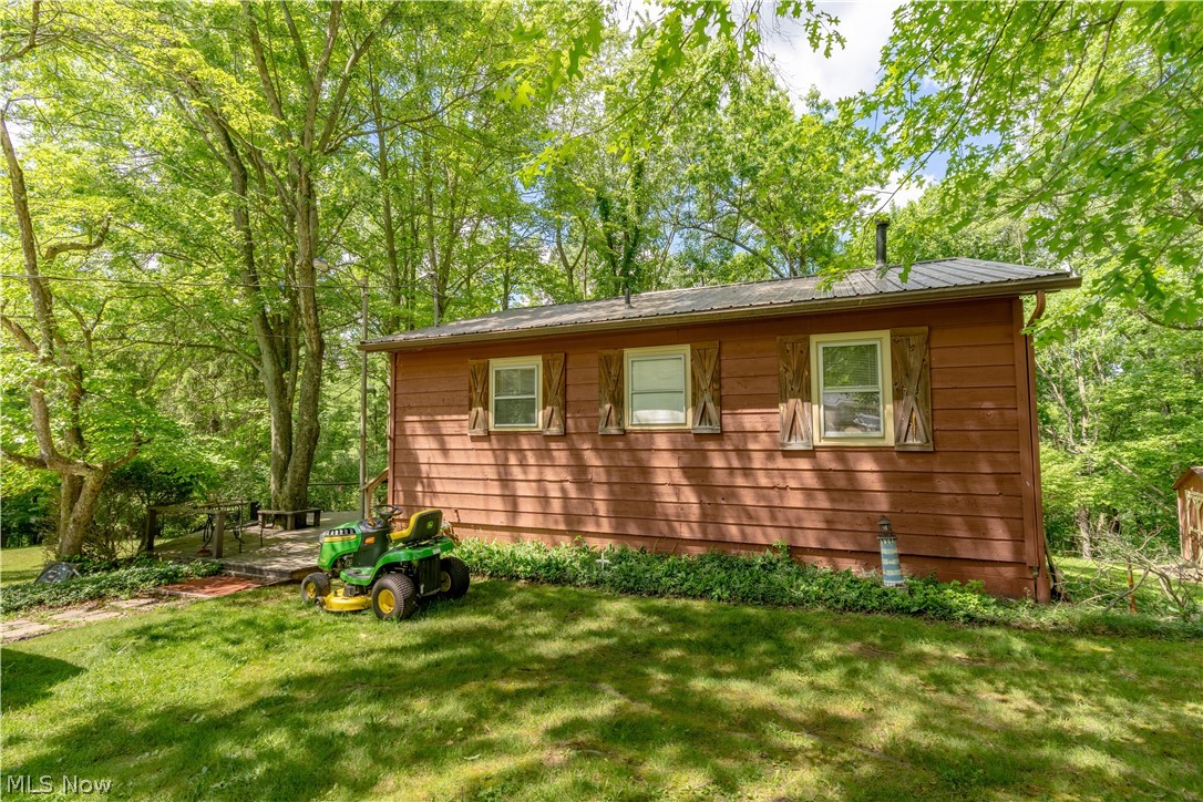 Tucked among the trees on two combined lots in the gated community of Lake Mohawk, this charming 2-bedroom, 1-bath cottage offers the perfect opportunity to enjoy lake living while making a place truly your own.

With approximately 702 square feet of living space, this home is ready to enjoy today, with the potential for future updates to match your style and vision. The peaceful setting provides seasonal lake views, mature trees, and additional outdoor space rarely found at this price point.

Step outside onto the deck and enjoy your morning coffee, unwind after a day on the water, or gather with family and friends while taking in the natural surroundings. Whether you're searching for a weekend getaway, year-round residence, or a place to escape from the everyday, this property offers the flexibility to fit your lifestyle.

Situated on two lots, the property provides room to enjoy the outdoors while creating your own personal oasis.

Discover the Lake Mohawk lifestyle. This private gated community features a 500-acre lake with unlimited horsepower boating, three beaches, marina facilities, pickleball and tennis courts, sand volleyball, playgrounds, clubhouse dining and social activities, and an executive 9-hole golf course with separate membership available. Whether you're looking for a weekend retreat or year-round living, Lake Mohawk offers recreation, relaxation, and a true sense of community in every season.

Don't miss this opportunity to own an affordable piece of Lake Mohawk and start making memories at the lake.