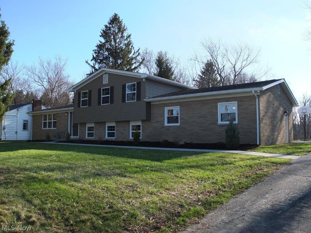 Beautifully updated 4 bedroom, 2 full bath, 4 level split in Perry Township! Living room with vaulted ceiling is open to the dining room. Completely remodeled kitchen with breakfast bar, new cabinets, new flooring and stainless steel oven, range, dishwasher and over the range microwave. Lower level family room with electric fireplace. Remodeled full bath with tile floor and bedroom 4 or office with double closets in lower level. 3 bedrooms and remodeled full bath with tile floor and tile shower and tub surround on the 2nd level. Master bedroom has direct access to the full bath. Full basement too! 2 car rear load garage and large deck off the dining room. Tons of updates including new furnace and central air, new septic system, new kitchen, all new bathrooms, new appliances, new sidewalk, new deck, doors, new garage door and opener, new windows, new hot water tank, new flooring and more! Schedule a private showing today!