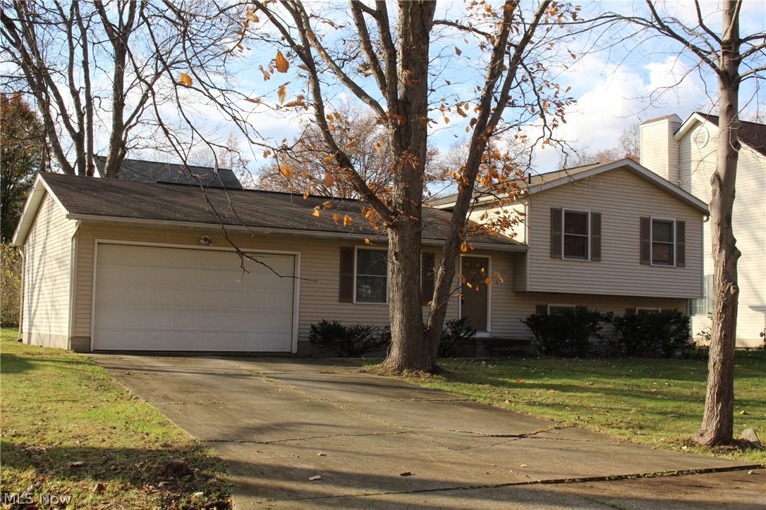 Dare to compare? Newer solid built home in Stow, OH,  4 bedrooms and 2 full baths, oversized 2 car garage,  granite  kitchen countertop, wood and carpet flooring, some brand new windows and sliding door.  Newer range, exhaust fan and hot water tank Great design with 3 bedrooms and 1 bath on one level and 1 bedroom with 1 bath on another. Basement waterproofed with transferable warranty.  Located in a quite beautiful neighborhood yet close to major roads and schools, stores… Good home great location, at this price, you will never find anything better….