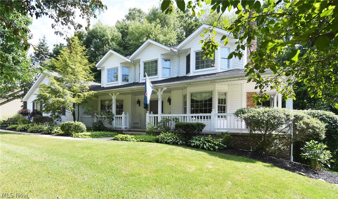 Quality built by Yoder Builders!  This home features a huge double lot/side yard with a wrap-around porch to admire the peaceful setting of the woods from the side and back.  Enter the 2-story hardwood foyer and enjoy the many spacious living spaces - formal living room with wood burning fireplace with french doors opening to your 19 x 10 screened-in porch to enjoy the seasons.  There's a door leading you to the nice deck as well.  The dining room will seat many guests.  Beautiful Schrock kitchen with updated granite, backsplash, pull out pantry and stainless steel refrigerator and dishwasher.  There's even a pass through to the dinette area with sliders to the beautiful deck and screened in porch. The first floor master features large walk in closet and full bath, laundry (with access to the deck) and powder room,which complete the first floor.  The 2nd floor offers 2 huge bedrooms w/bay windows and spacious full bath w/dbl vanity, granite and skylight (master could be on the 2nd floo