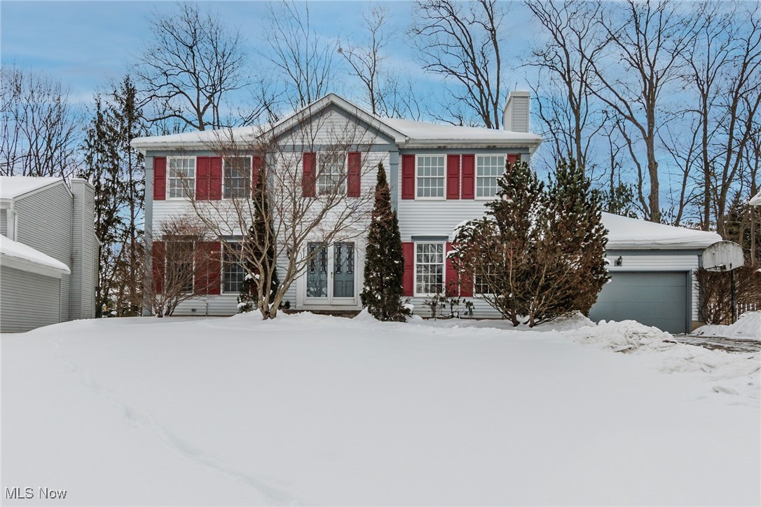 Welcome to this spacious 4-bedroom Center Hall Colonial, perched on a hill in the highly desirable Spyglass Hill community. A grand two-story foyer sets the tone as you step inside, where you'll immediately notice the home has been completely refreshed with brand-new paint and carpeting throughout. The formal family room showcases a wet bar, wood-burning fireplace, and architectural beamed ceilings, while the formal dining room and expansive living room provide ideal spaces for entertaining. The large eat-in kitchen features stainless steel appliances and a brand-new stove, with sliders leading to an expansive two-tier deck perfect for hosting or relaxing while overlooking your private, wooded lot. A convenient first-floor laundry room and half bath complete the main level. Upstairs, the grand staircase leads to a spacious primary suite with soaring vaulted ceilings and an ensuite bath offering a skylight, soaking tub, walk-in shower, and dual vanity. Three additional generously sized bedrooms and a full bath complete the second floor. The lower level offers high ceilings and endless potential for future living space, or ample storage as is. Move-in ready and ideally located with access to a community pool, tennis courts, and clubhouse. Don't miss this exceptional opportunity! Schedule your private tour today!