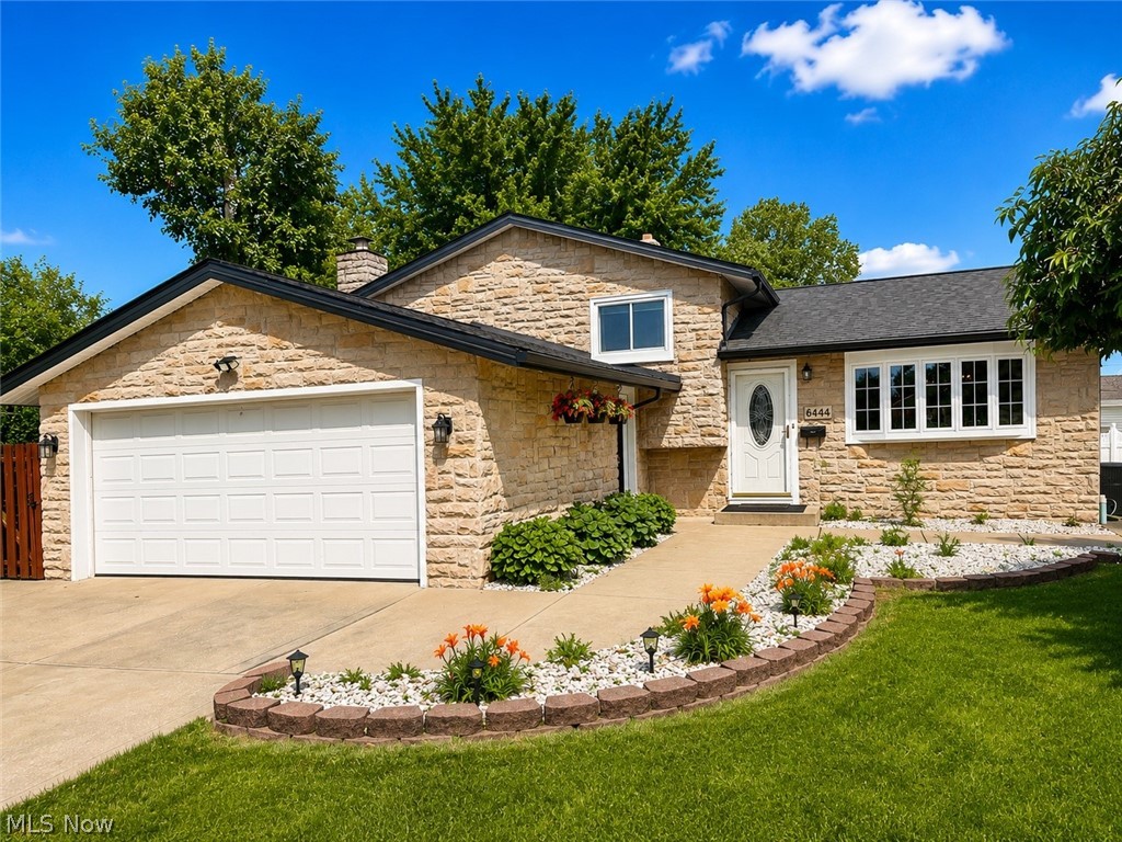 Welcome home to this beautifully remodeled 3-bedroom, 2-full-bath split-level home in Brook Park. The main level offers a warm and inviting layout featuring a spacious living room with hardwood floors, a dining area with hardwood flooring, and an updated kitchen complete with granite countertops, ceramic tile flooring, modern cabinetry, and included appliances—dishwasher, stove, and refrigerator.

Upstairs, you'll find three comfortable bedrooms with hardwood floors and a fully remodeled bathroom featuring ceramic tile throughout.

The lower level provides additional living space with a large family room highlighted by a cozy fireplace, a coffee bar area, and an extra prep kitchen with granite countertops. An updated laundry room adds convenience and functionality.

Step outside to enjoy the beautiful covered porch overlooking the fully fenced backyard with a wooden privacy fence—perfect for summer gatherings, pets, or relaxing evenings outdoors. A storage shed provides additional space for tools and equipment.

The oversized 2-car garage offers plenty of extra storage space. This home has been extensively updated and improved on the interior and exterior, including the hot water tank, furnace, roof, windows, siding, stone front exterior, driveway, sidewalks, and covered porch.  

This move-in-ready home is a must-see to truly appreciate the quality craftsmanship, thoughtful updates, and beautiful finishes throughout!