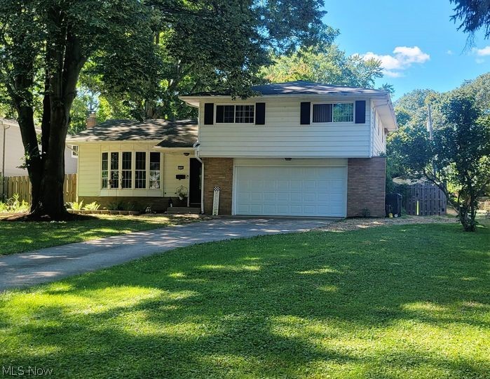 This GORGEOUS home is located right on the Parkway! BRAND NEW INSULATED GARAGE DOOR JUST INSTALLED! BRAND NEW CARPET ON STAIRS!  As you enter the welcoming foyer you immediately will feel as if you're home! Stunning as well as enormous living room, completely updated SPECTACULAR kitchen which includes beautiful granite and fabulous appliances which all stay, formal dining area flows right off the kitchen, cozy family room, & completely updated half bath just off the family room! The upper most level features four VERY SPACIOUS bedrooms & a Full bath! The full basement features tons of storage, glass block vented windows, and upscale washer & dryer also included! As you walk through the newer slider you will be in awe at the grounds! The .35 acre lot is absolutely STUNNING & features a huge above ground pool (all supplies and chemicals included) perfect on a hot summer day, a large newer stamped patio perfect for entertaining, & a great shed to utilize for storage! The grounds also feature a privacy fence! There is a large two car attached garage, newer windows throughout, a home humidifier, plus a one year home warranty for peace of mind! SERIOUSLY DO NOT MISS THIS RARE OPPORTUNITY!!!!