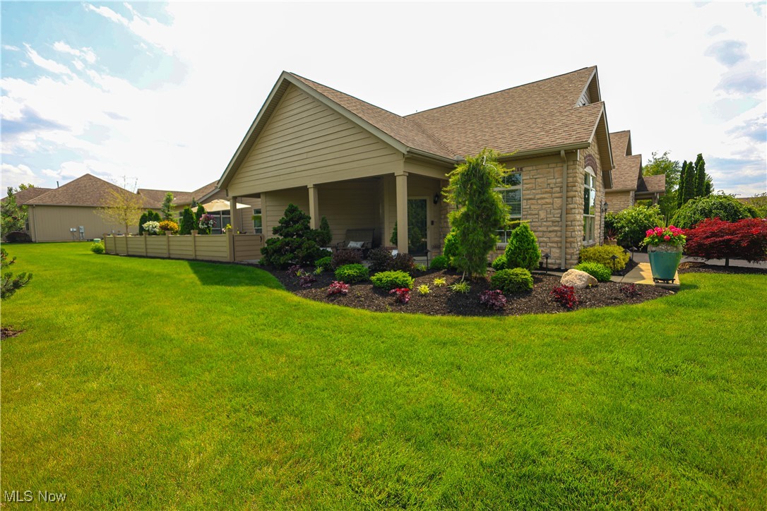 Extraordinary stand alone, one-of-a-kind condo located in The Sanctuary, offers unmatched comfort, design, & functionality. Condo has been thoughtfully customized with unique features throughout. Spacious open floor plan is perfect for both everyday living & entertainment, highlighted by a newer, gorgeous stone fireplace & beautifully crafted Amish-built bookcases. Stunning chic bar room, featuring stained glass doors & its own refrigerator. Kitchen is a true centerpiece with a large island & a complete appliance package. Master suite includes a custom-designed walk-in closet & an updated bath that exudes luxury. Comfort & efficiency are further enhanced with added insulation, a heated garage & attic space providing ample storage. Step outside to your private, fenced-in patio expertly landscaped with ambiance lighting, extended pavers, upgraded patio surfacing, & even a special doggy area. Every corner of this home reflects quality & care. Be sure to see the attached highlight sheet
