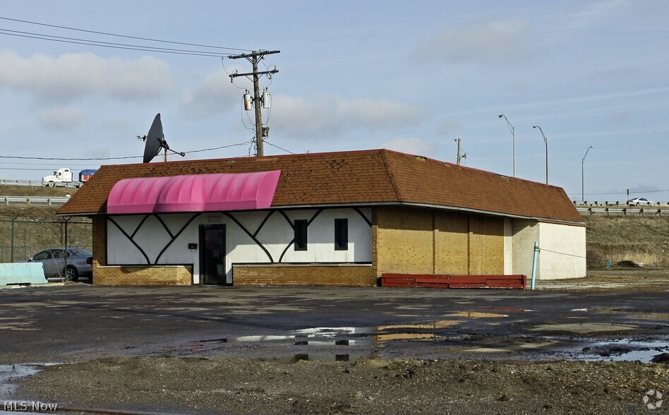 Prime redevelopment opportunity in a rapidly growing area! This commercial building offers over 3,000 sq ft and sits on more than .60 acres, providing endless potential for investors, entrepreneurs, and business owners alike. Currently undergoing renovations, the property comes with a valuable liquor license and is grandfathered for adult entertainment use, a rare opportunity with flexible possibilities for future operations. Perfect for a sports bar, lounge, nightclub, entertainment venue, restaurant, or other high-traffic business concepts. Conveniently located just down the street from the future Cleveland Browns stadium development, positioning this property in the path of major future growth and increased traffic. With redevelopment and excitement already building in the area, now is the perfect time to invest and bring your vision to life. Don't miss this unique chance to secure a high-potential commercial property in an up-and-coming destination!