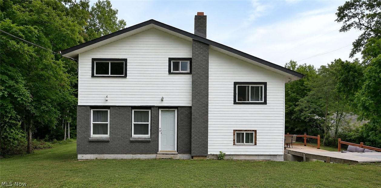 Welcome home to this beautifully updated split-level situated on nearly 2 private acres in desirable Beaver Township and the South Range School District!
This move-in ready home offers 3 bedrooms with the potential for a 4th, along with extensive updates throughout. The heart of the home is the stunning, fully remodeled kitchen featuring new butcher block countertops, new flooring, rustic tile backsplash, farmhouse sink, updated appliances, and abundant cabinetry, all opening to a spacious dining area perfect for gatherings. The warm farmhouse-inspired design creates an inviting space for everyday living and entertaining.
The bright living room showcases a charming beamed ceiling, fresh paint, and new flooring, adding character and comfort.
The second level features two generously sized bedrooms with ample closet and storage space, along with new carpeting throughout. The private third-floor primary suite offers a peaceful retreat complete with a beautifully renovated full bathroom featuring a new vanity, custom walk-in tiled shower with cobblestone flooring, and a Bluetooth LED light/speaker.

The walkout lower level provides valuable additional living space that can be used as a family room, rec room or home office. You'll also find a separate utility/laundry area with washer and dryer hookups and plenty of storage space.
Additional interior updates include all new plumbing, a new hot water tank, newer furnace, and updated septic tank switch.
Step outside to enjoy your own private oasis! The brand-new 18' x 28' wood deck with railings is ideal for entertaining or relaxing while overlooking the nearly 2-acre tree-lined backyard. The property also includes a fully fenced chicken coop, a storage shed, and plenty of open space for gardening, recreation, or simply enjoying the peaceful surroundings.
With modern updates, farmhouse charm, and a private country setting just minutes from local conveniences, this exceptional home is one you won't want to miss!