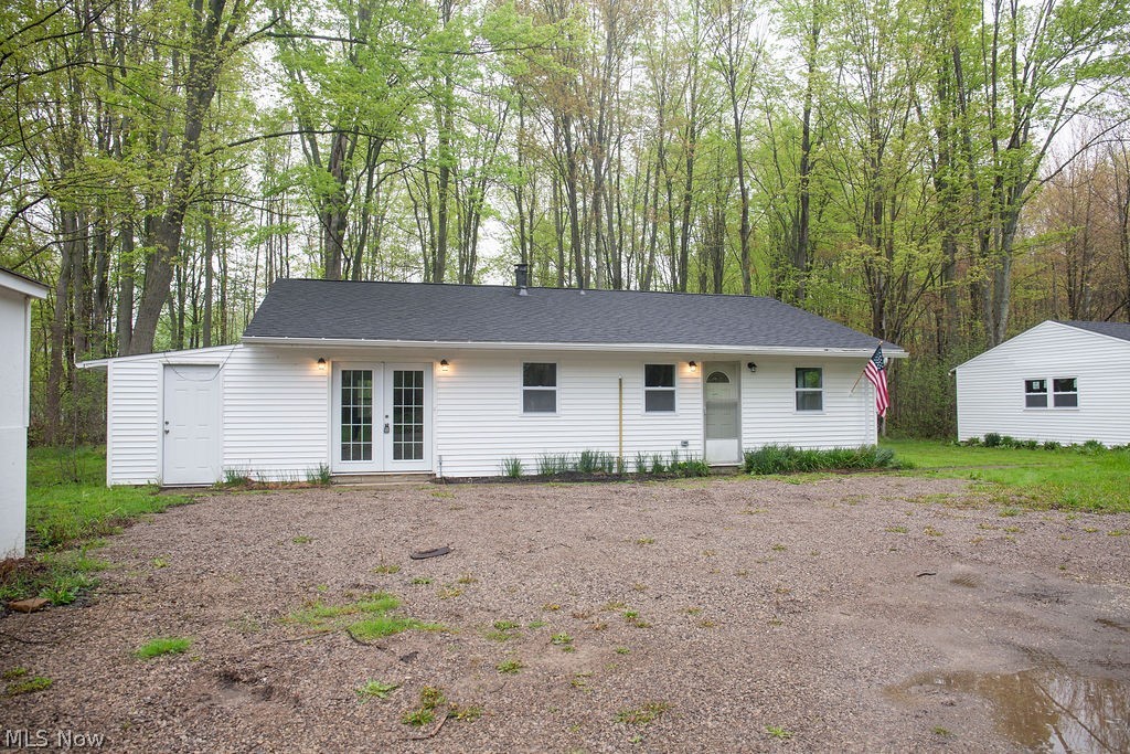 The property at 3644 Padanarum Road in Geneva is an updated ranch-style home situated on approximately one acre with a deep setback from the roadway, offering added privacy and separation from traffic. The interior has been recently painted and features an updated kitchen with white cabinetry and white granite countertops, an updated bathroom, and all new light fixtures throughout. The home offers three bedrooms, a dedicated laundry room, and a newer boiler heating system. Additional improvements include an oversized detached two-plus-car garage, providing ample storage and utility space. Overall, the property presents as a well-maintained and updated residence with functional features and strong overall utility.