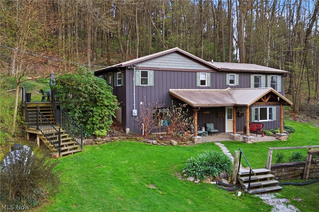 Rare opportunity to own a fully furnished Mohican retreat offering the perfect blend of personal enjoyment and income potential. Currently operating as a successful short-term Airbnb with proven rental performance; historical income and expense data available upon request. Whether you're seeking a weekend getaway, second home, or investment property, this one is ready to deliver from day one. Situated on 2+ acres and including an additional building lot, the property offers flexibility for future expansion, resale, or added privacy. Ideally located just minutes from Pleasant Hill Reservoir and Mohican State Forest, you'll enjoy convenient access to boating, fishing, kayaking, hiking trails, and year-round outdoor recreation in one of Ohio's most sought-after destinations. Inside, the home features cathedral ceilings that create an open, airy feel, along with an updated kitchen and baths, newer flooring, and a spacious finished walkout lower level that adds functional living and entertaining space. The layout is designed to comfortably accommodate guests or provide a relaxing personal retreat. Outdoor living is a true highlight, with a wraparound deck and covered patio that invite you to unwind and take in the peaceful natural setting. Thoughtfully curated amenities enhance the experience, including a hot tub, fireplace, 85'' TV, and Weber grill--ideal for entertaining or quiet evenings. Additional features include a 2-car detached garage with EV charging capability and a property that is being sold fully furnished, making the transition seamless for the next owner. A pre-inspection has been completed and is available for review, offering added confidence and transparency. A rare chance to own a turn-key property in the heart of the Mohican area--whether for personal use, investment, or both.