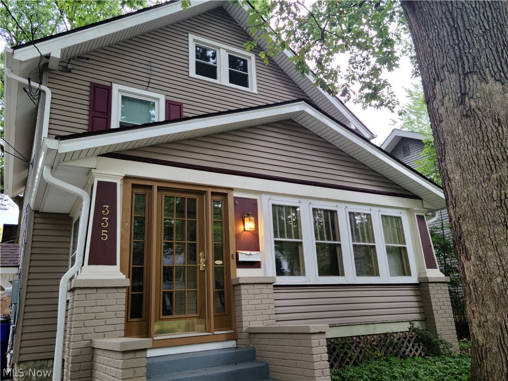335 N Willow St Kent OH 44240 is a beautiful & charming home with natural woodwork showcased throughout on a tree lined street! Includes 3 or 4 bedrooms, 1.5 baths w/ half bathroom on the 1st floor w/ easy access to the mudroom from the fenced in rear yard for your family fun, especially with the 2 decks & concrete patio areas! Conveniently located just a couple of blocks to downtown Kent restaurants, shopping, trails, parks, river & only 2 blocks to Kent State University Campus! Great entertainment w/ live music venues, Kent State Athletics with hometown fields, Portage & Summit Counties Bike & Hike Trails, several micro breweries & many eateries from American, Mexican, Asian, Greek, Mediterranean & more! You can even skate downtown in the winter or at the ice rink year round, there is no end to what you can do! If you prefer to stay home, you can entertain since the Living Room w/ built-ins & hardwood floors opens to the Dining Room w/ wood window seat, a quaint enclosed front porch