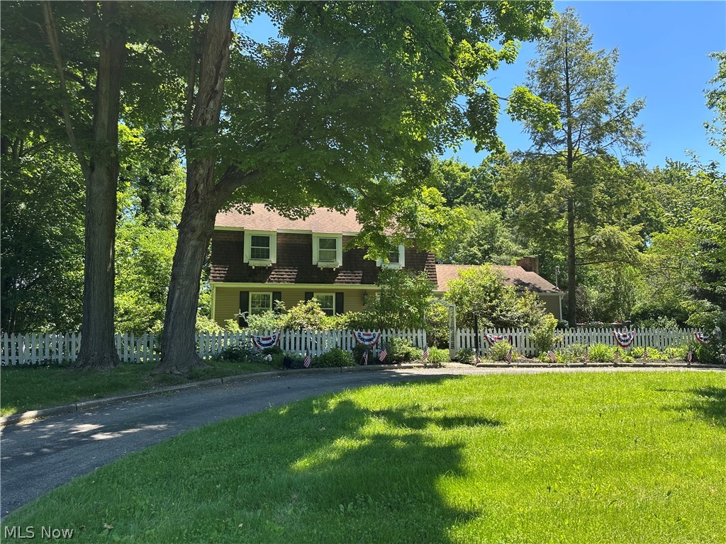 Welcome to 4599 Tippecanoe Road located within the Canfield Local School District.  Situated in Boardman Township, this spacious 4-bedroom, 3-bath home offers approximately 2,340 square feet of living space and is ready for it's next chapter.  Built in 1974, the home features a versatile floor plan with a main-level family room complete with a fireplace, a kitchen with ample space for everyday living, a formal living room, formal dining room and a full bath.  An additional dining and bar area provides direct access to the rear deck and in-ground pool, creating a seamless transition to outdoor living and entertaining.  The second floor offers four bedrooms and two full bathrooms, while the basement includes a laundry area and additional storage potential.  A detached two-car garage and circular driveway provide convenient parking and easy ingress and egress.  Set on a generously sized lot, this property offers a unique opportunity for buyers looking to add their own updates and personal touches.  Being sold as-is, the home presents tremendous potential for renovation, customization, and long-term value.  Bring your vision and explore the possibilities that await at 4599 Tippecanoe Road.
