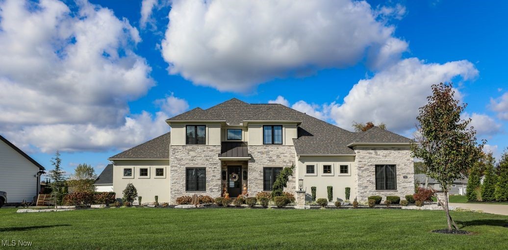 Beautiful Memmer home in Jackson Township.  Located in highly sought after Berkshire Farms neighborhood.  This 4 bedroom, 3.5 Bath home is breathtaking.  Upon entering the home, you are greeted by an inviting foyer and office.  The large family room has a fireplace with open living from the family room through the dining area and into the kitchen.  The kitchen boasts a large wine room with butler's pantry and sink.  There is a walk in dry food pantry as well.  A mudroom with built in lockers and shelves is located off the two-car garage.  Retreat to the owner's suite on the main level.  The owner's ensuite offers an oversized tile shower with glass walls, separate vanities, and large walk-in closet with shelves and built in storage.  The second floor is equally impressive.  There are three generously sized bedrooms with a walk through Jack and Jill Bath and a junior suite.  The backyard is perfect for family gathering or entertaining.  It comes complete with a beautiful inground swimming pool, patio, and outdoor kitchen/entertaining area.  There are professional landscaping and lighting throughout with a fenced back yard.  Don't wait to schedule your private showing on this truly spectacular property.