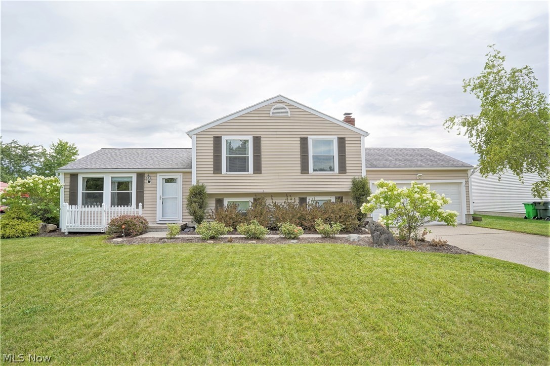 Dream a little dream right here in Stow Ohio with this spacious split level. This 2000+ sq foot home offers  3 bedrooms and 3 full bathrooms.  It also features a large living room, an updated kitchen with stainless appliances, and maple cabinets. The dining room features ceramic flooring and opens to a 4 seasons room that overlooks the back deck and yard. The master suite upstairs has a balcony for morning coffee and a full private bath. The lower level offers a large family room with a brick fireplace and built-ins. There is a small office and another full bath as well. The backyard has a  two-tiered deck across the back of the house that is great for entertaining. Don't Forget about the fully fenced-in backyard and the shed. Set up your private showing today!