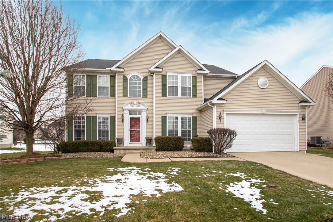 Welcome to 4527 Ridgestone Way! This stunning Montville Township home has been meticulously cared for, and offers tons of space to relax or entertain. Step into the two-story foyer, noticing new ceramic tile and wood laminate floors throughout the main level. An office space is to the right, while a formal living room with wainscoting flows neatly into a formal dining room with a tray ceiling. The main living area offers an open floor plan, with sightlines across a family room with a gas fireplace, a morning room with vaulted ceilings and patio access, and a spacious kitchen with extra bar seating and stainless appliances. An updated half bathroom and spacious laundry room with garage access complete the main level. Upstairs, discover a massive primary suite with a bonus sitting area and an oversized walk-in closet. The primary ensuite offers a wide double vanity, shower, and soaker tub. Down the hall, three additional bedrooms share a spacious full bathroom. The finished basement can