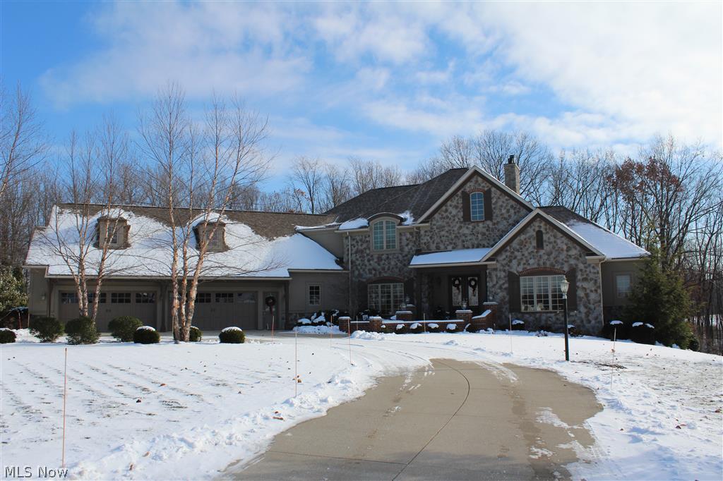 This Biltmore Estate home on 2.35 acres was custom built by Memmer Homes.  exceptional quality & detail are evident in this 5 bedroom, 5.5 bath home w/7,000+ sq. ft.  Walk up to the gorgeous double door front courtyard into a barreled ceiling foyer.  Once inside you will see how open the 1st floor is!  There is a 1st flr office with built in bookcases & first floor master suite w/private deck overlooking the fabulous backyard.  Soaring great room opens to an amazing kitchen.  Back hallway is an owners dream... walk-in pantry, desk, walk in closet & laundry room.  Upstairs there are 3 add'l bedrm suites.  The walkout lower level has a 5th bedrm, full bath, theater rm, family rm w/stone fireplace, workout rm & office.  The exterior living is a true paradise w/your own private walking trail, gazebo, water fall, bridge & picnic area.  The landscaping is lavish & absolutely beautiful.  Get ready to fall in love.  Extensive decking & patios makes this truly a great place to live & entertain.