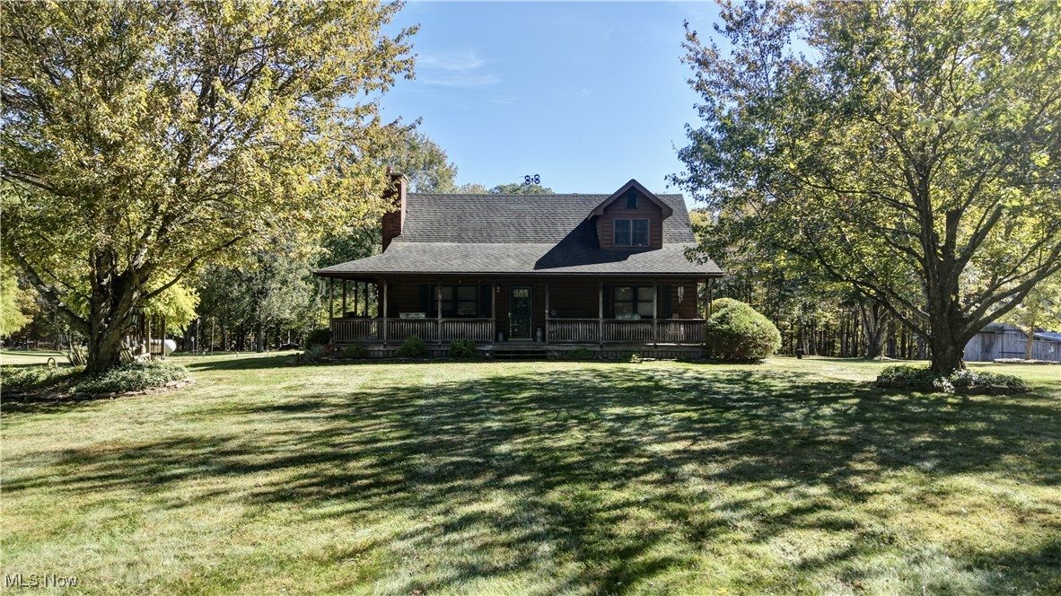 Nestled on 10 acres of picturesque woodland, this charming 3 bed/2.5 bath home boasts beautiful log siding that blends seamlessly with its natural surroundings. The interior features built in custom woodworking through out. The basement is partially finished and offers a utility room and workshop area with a walk out access.  The property features a versatile workshop with a garage bay, a pavilion perfect for outdoor gatherings, a convenient storage building, and a barn, making it ideal for that 4-H project or any of your animal needs. Additionally, a quaint rustic cabin offers a cozy retreat within the woods. The entire estate is enveloped in a serene, park-like setting, offering both privacy and tranquility.