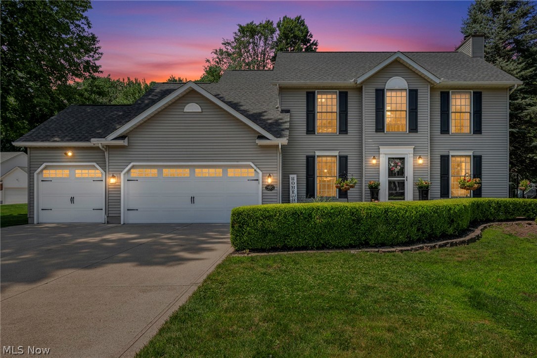 Welcome to 5472 Wixford Lane, where water views, a desirable cul-de-sac setting, and luxury updates create an exceptional place to call home. Situated on a half-acre lot in Mentor, this move-in ready colonial offers approximately 3,180 square feet of finished living space with quality updates throughout. The remodeled kitchen features quartz countertops, a 9-foot island, soft-close cabinetry, designer backsplash, under-cabinet lighting, and GE Café stainless steel appliances. It opens to the inviting family room with custom built-ins and a fireplace, while formal living and dining rooms provide additional entertaining space. The spacious owner's suite includes a custom closet system and a renovated spa-inspired bath with a granite double vanity, frameless LED anti-fog mirror, rainfall shower with body jets, and porcelain tile flooring. Updated bathrooms add style and comfort throughout. The finished lower level features a custom bar, beverage refrigerators, designer fireplace, luxury vinyl flooring, and an updated half bath, creating the perfect entertaining space. Enjoy the freshly stained deck overlooking peaceful pond views. Major improvements include a new roof with transferable warranty (2025), furnace, central air, hot water tank (2022), upgraded electrical panel, radon mitigation system, sprinkler system, updated garage doors and openers, luxury vinyl flooring, and programmable thermostat. For added peace of mind, the home has been professionally pre-inspected. Complete with a 3-car garage and located near shopping, dining, parks, and schools, this beautifully updated home offers the perfect combination of comfort, style, and convenience.